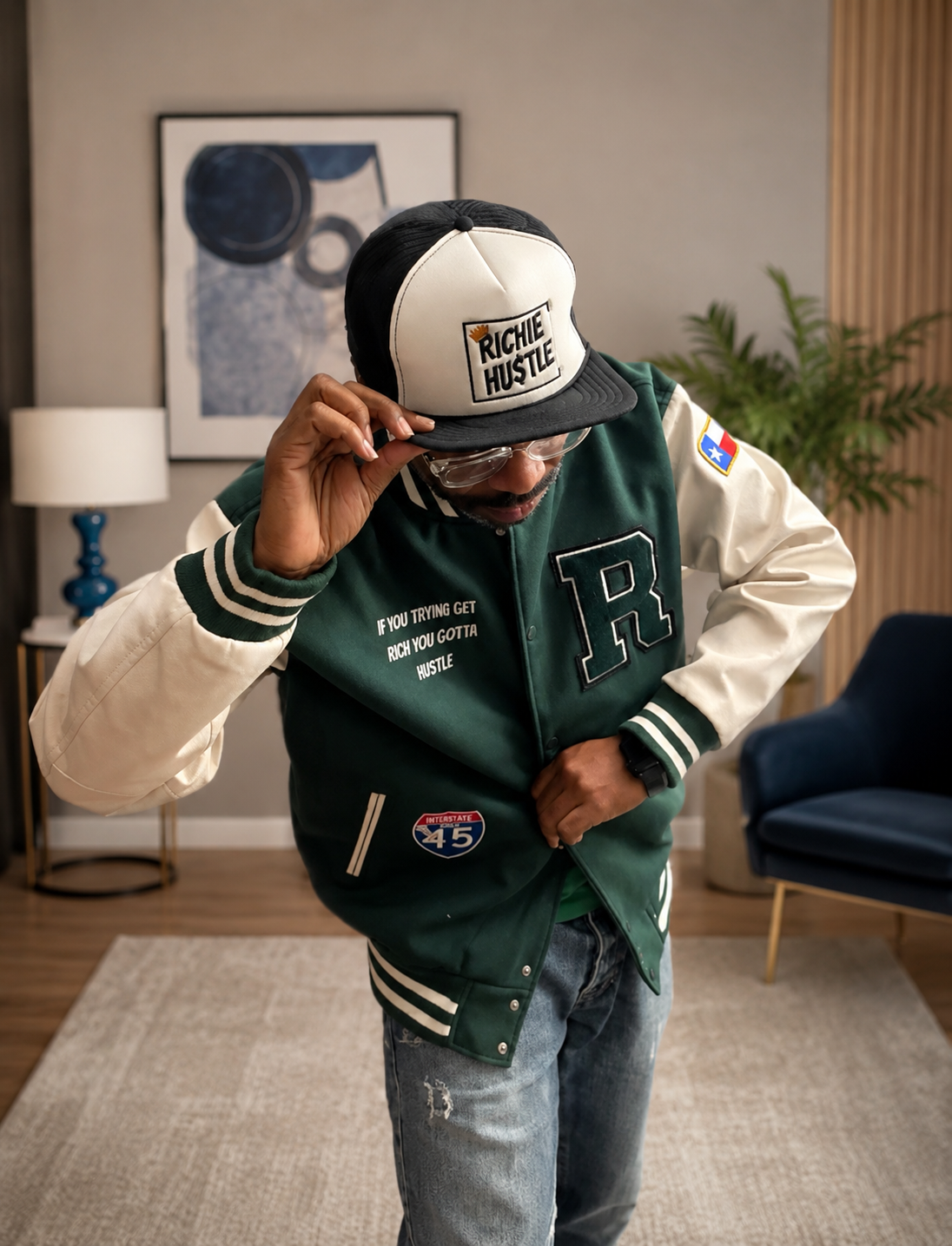 MAHA Make America Hustle Again, Letterman jacket and Richie Hustle Trucker hat, modeled by Clint Bell