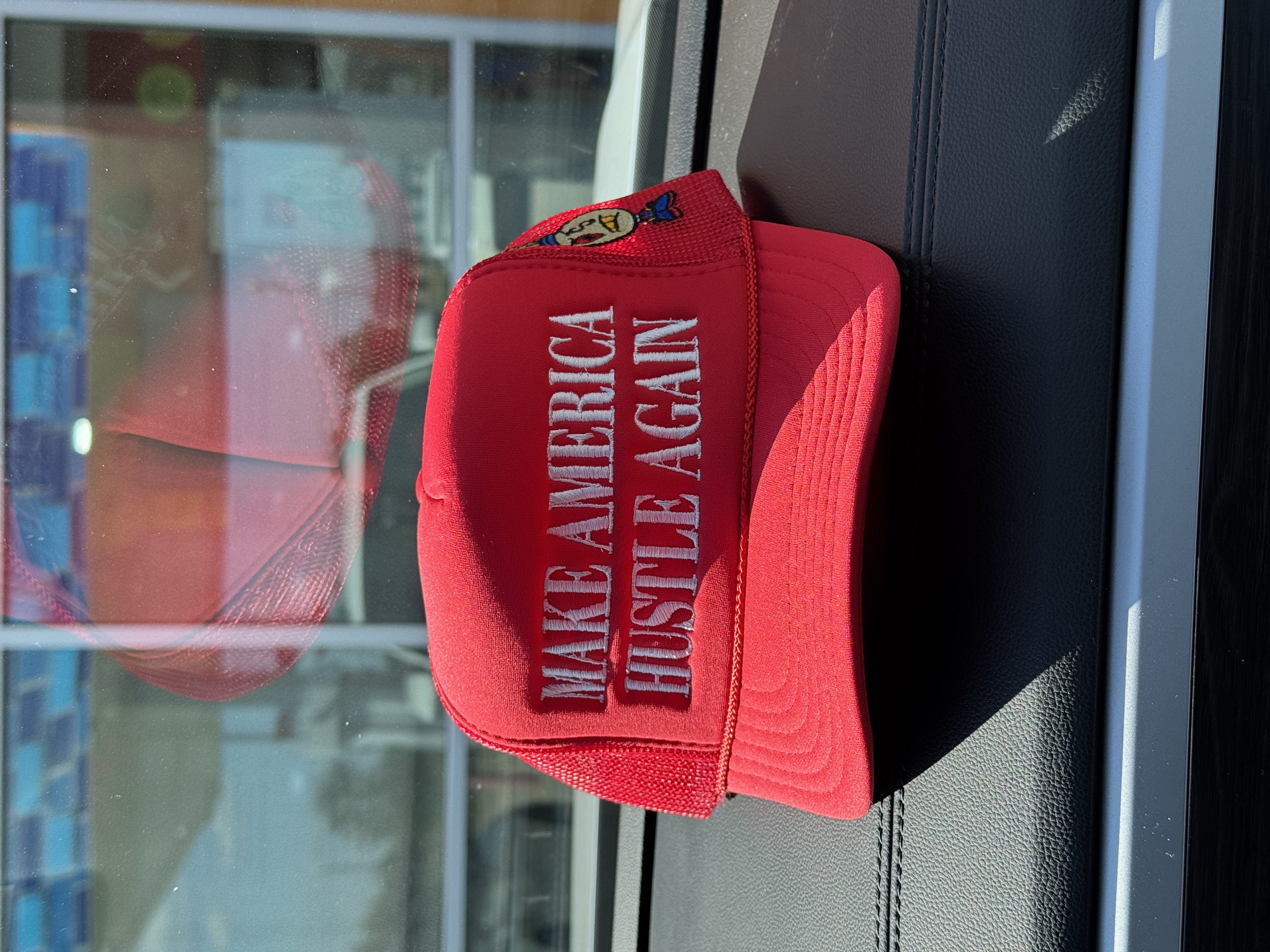 MAHA Make America Hustle Again trucker hat, red colorway